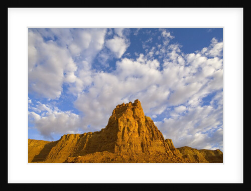 Cumulus Clouds Over Sandstone Buttes at Sunrise by Anonymous