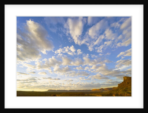Cumulus Clouds Over Sandstone Buttes at Sunrise by Anonymous