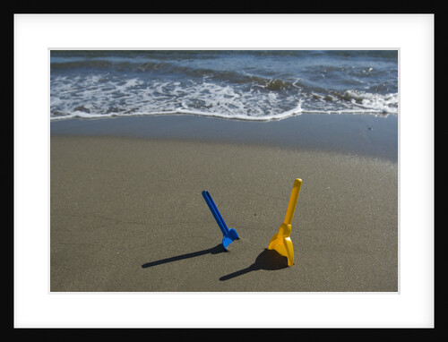 Toy Shovels in Sand by Anonymous