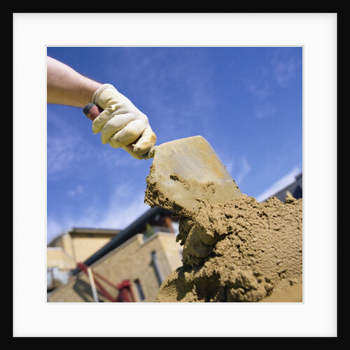 Bricklayer Applying Cement onto Bricks by Anonymous