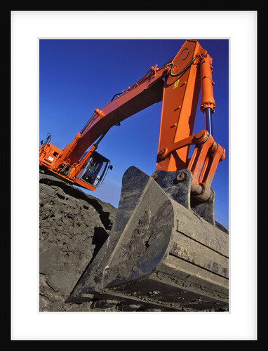 Backhoe Working on Muddy Construction Site by Anonymous