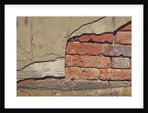 Brick Wall Part Covered By Plaster by Anonymous