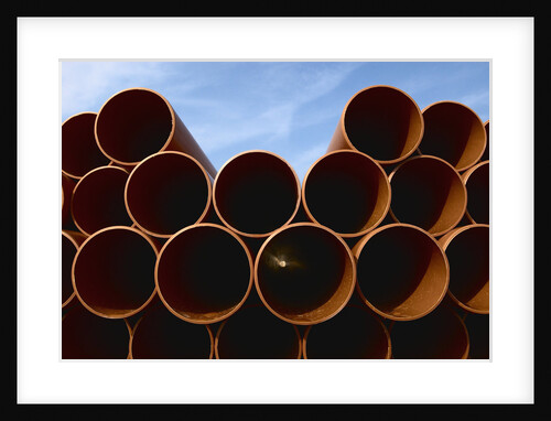 Stack of Water Pipes on Construction Site by Anonymous