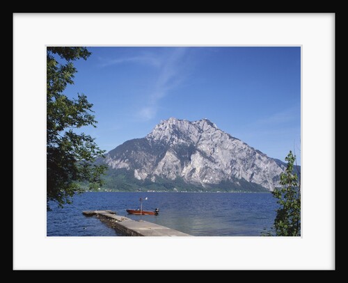 Wooden Boat Tied to Dock on Lake by Anonymous