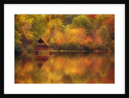Wooden Cabin on Lake in Autumn by Anonymous