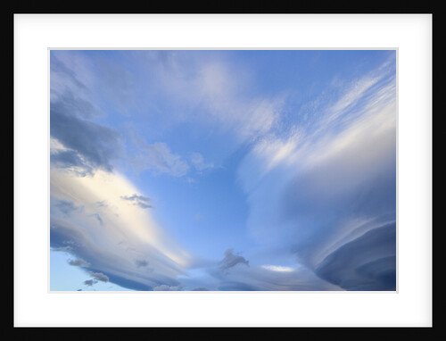Bright Cumulus and Lenticular Clouds at Sunrise by Anonymous