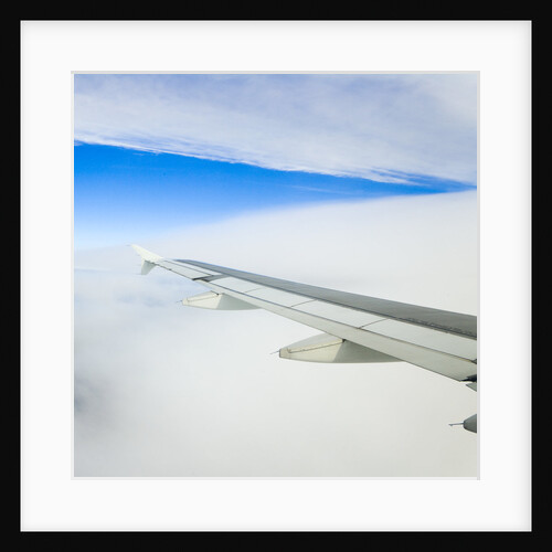 Airplane Wing Above Clouds by Anonymous