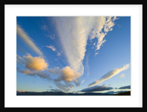 Cumulus Clouds above Mountains at Sunset by Anonymous