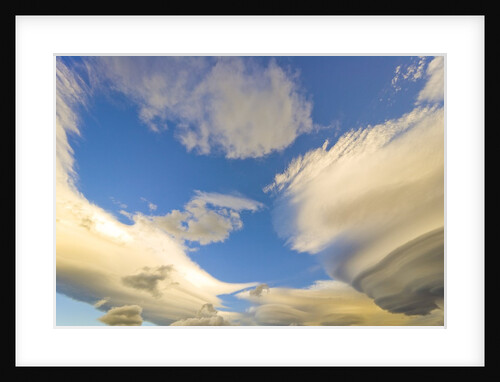 Cumulus and Lenticular Clouds at Sunrise by Anonymous
