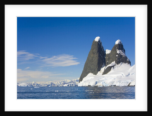 Snowcapped Pinnacles on Coast by Anonymous