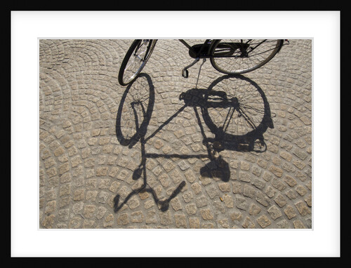 Bicycle Shadow on Cobblestone by Anonymous