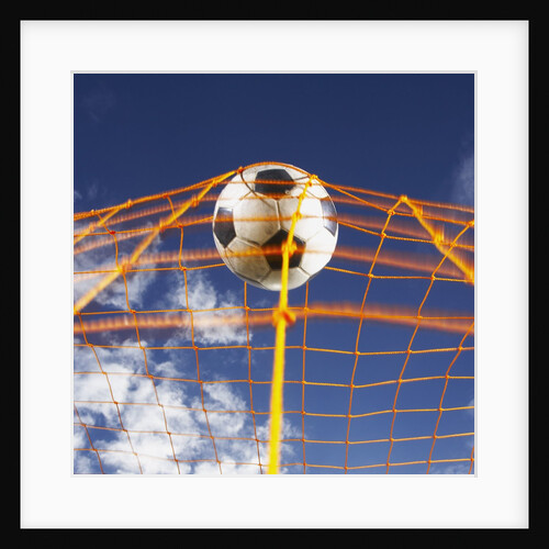 Soccer Ball Going Into Goal Net by Anonymous