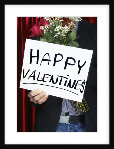 Man holding "Happy Valentine's" sign by Anonymous
