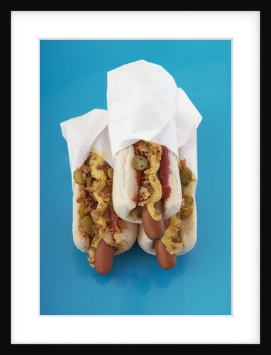 Three hot dogs in buns by Anonymous