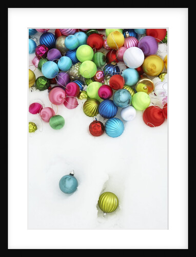 Christmas ornaments on snow by Anonymous