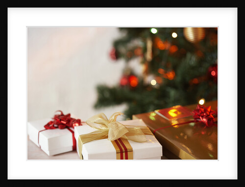 Gifts under a Christmas tree by Anonymous