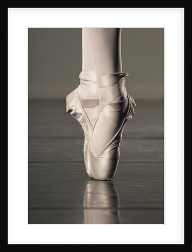 Feet of ballet dancer en pointe by Anonymous