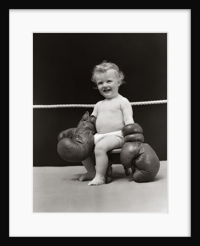 1930s Baby Seated On Stool In Boxing Ring Wearing Oversized Boxing Gloves Wearing Diaper by Anonymous