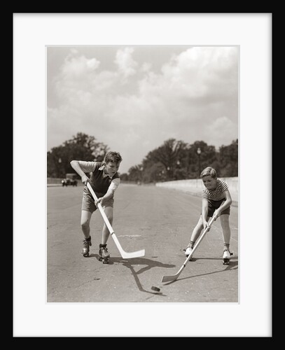 1930s 1940s 2 Boys With Sticks And Puck Wearing Roller Skates Playing Street Hockey by Anonymous