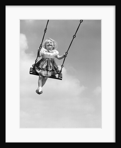 1950s Laughing Little Girl Swinging High On Outdoor Swing by Anonymous