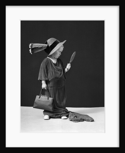 1930s 1940s Girl Playing Dress-Up Looking At Herself In Hand Mirror by Anonymous