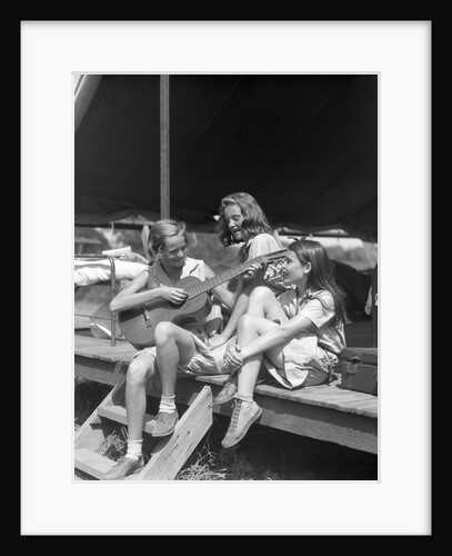 1930s Three Girls At Summer Camp Having Sing-Along One Playing Guitar by Anonymous
