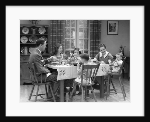 1930s Family Of 6 Sitting At The Table In A Dining Room Eating Breakfast The Baby Is Sitting In A High Chair by Anonymous