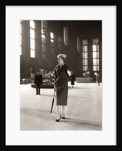 1950s Fashionable High Class Woman Alone Train Station Umbrella Waiting Lonely by Corbis