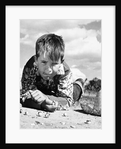 1950s Boy Shooting Marbles Outdoor by Anonymous