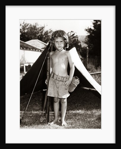 1950s Boy Playing Soldier Standing With Rifle Helmet Canteen Tent by Anonymous