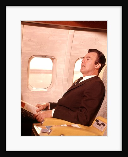 1960s Man Sitting In First Class Airplane Passenger Seat by Anonymous