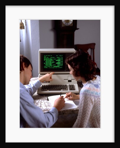 1980s Teenage Couple Boy And Girl Working Together On Apple Iii Personal Computer by Anonymous