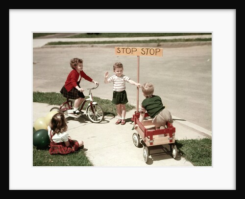 1950s Boys And Girls Outdoor With Tricycle And Wagon Playing Traffic With Police Stop Sign Americana by Anonymous