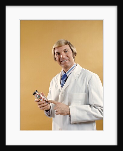 1960s 1970s Man Doctor Pharmacist White Jacket Holding Bottle Pills by Anonymous