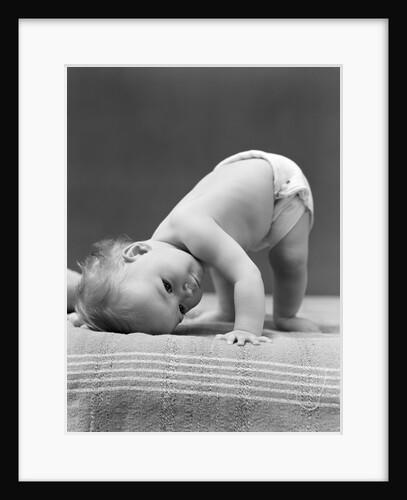 1940s Baby Bending Down With Head On Blanket by Anonymous
