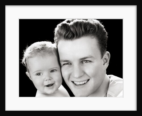 1940s Portrait Of Father Holding Baby Daughter To Cheek by Anonymous