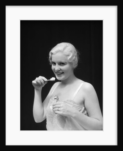 1930s Woman Holding Tooth Paste And Tooth Brush Btushing Teeeth by Anonymous