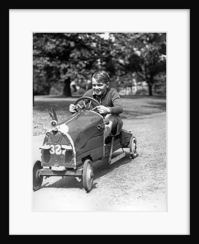 1930s Boy Driving Home Built Race Car Holding Steering Wheel by Anonymous