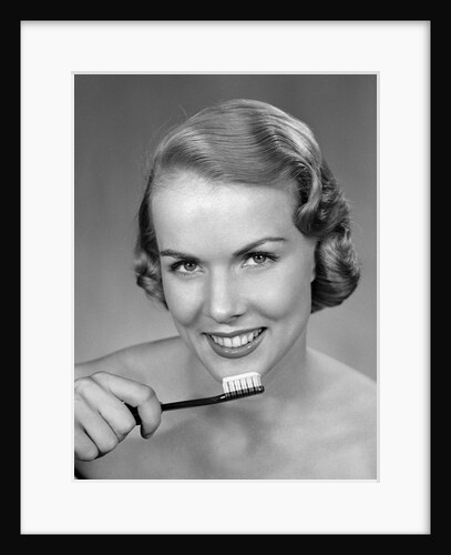 1950s Woman Holding Tooth Brush by Anonymous