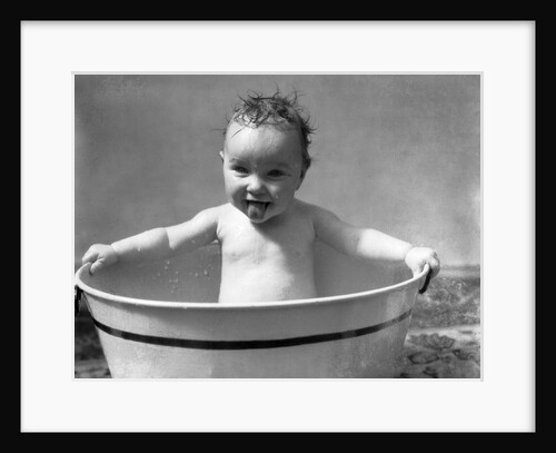 1930s Wet Baby In Washtub Sticking Out Tongue by Anonymous