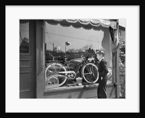1950s Boy On Sidewalk Looking At Bicycle In Store Window by Anonymous