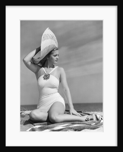 1940s Woman In White Bathing Suit On Beach Wearing Big Straw Hat by Anonymous