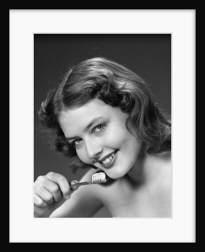 1940s 1950s Woman Holding Tooth Brush by Anonymous