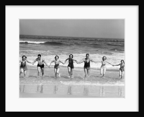 1930s Group 7 People Holding Hands Running Out Of Surf Onto Beach by Anonymous