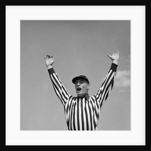 1950s Football Referee Making Touchdown Signal by Anonymous