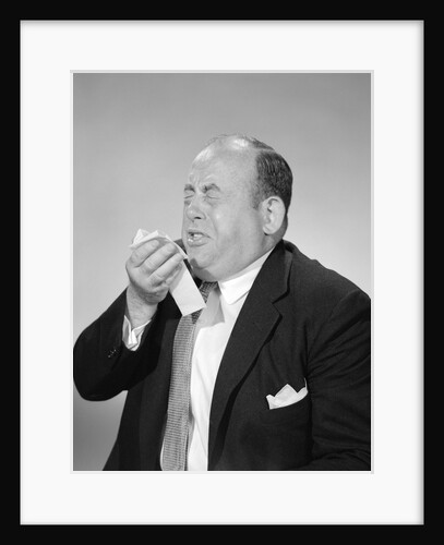 1950s 1960s Bald Man Sneezing Handkerchief To Nose by Anonymous