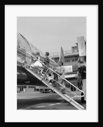 1950s Family Boarding Propeller Airliner By Climbing Gangway Stairs At Airport by Anonymous