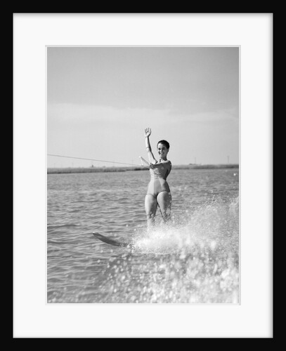 1960s Woman Water Skiing Waving With One Hand by Anonymous