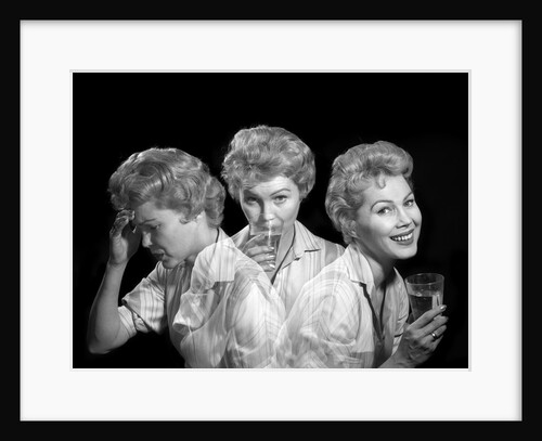 1950s 1960s Woman With A Headache Taking Medicine And With Expression Of Relief From Pain by Anonymous