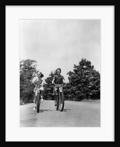 1940s Boy Girl Riding Bikes Down Country Lane by Anonymous